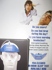 Husband, wife, company brochure on snoring