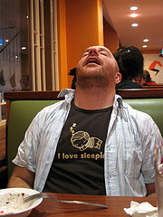 Man sleeps in a restaurant